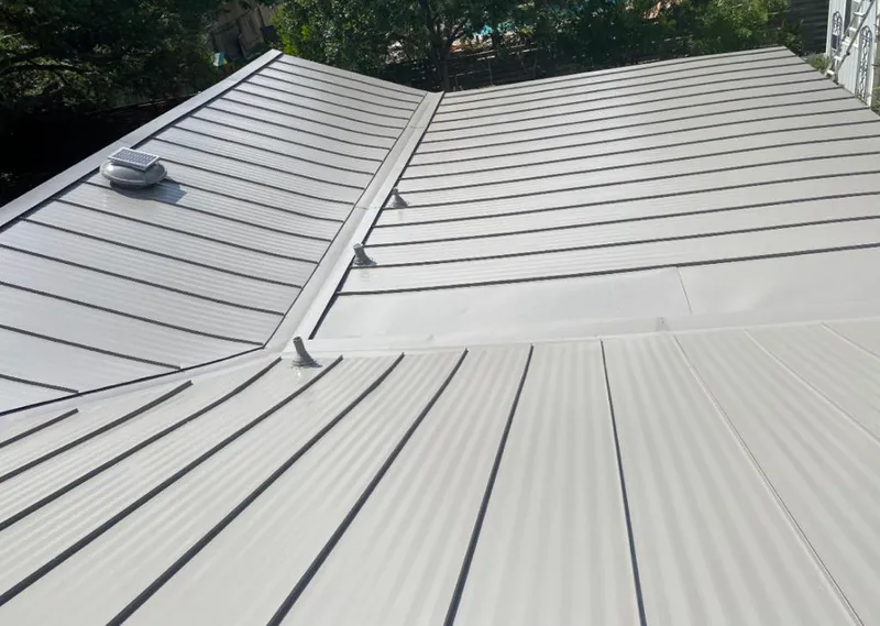 Solar attic fan installed on a metal roof for Roof Ventilation in Port Huron